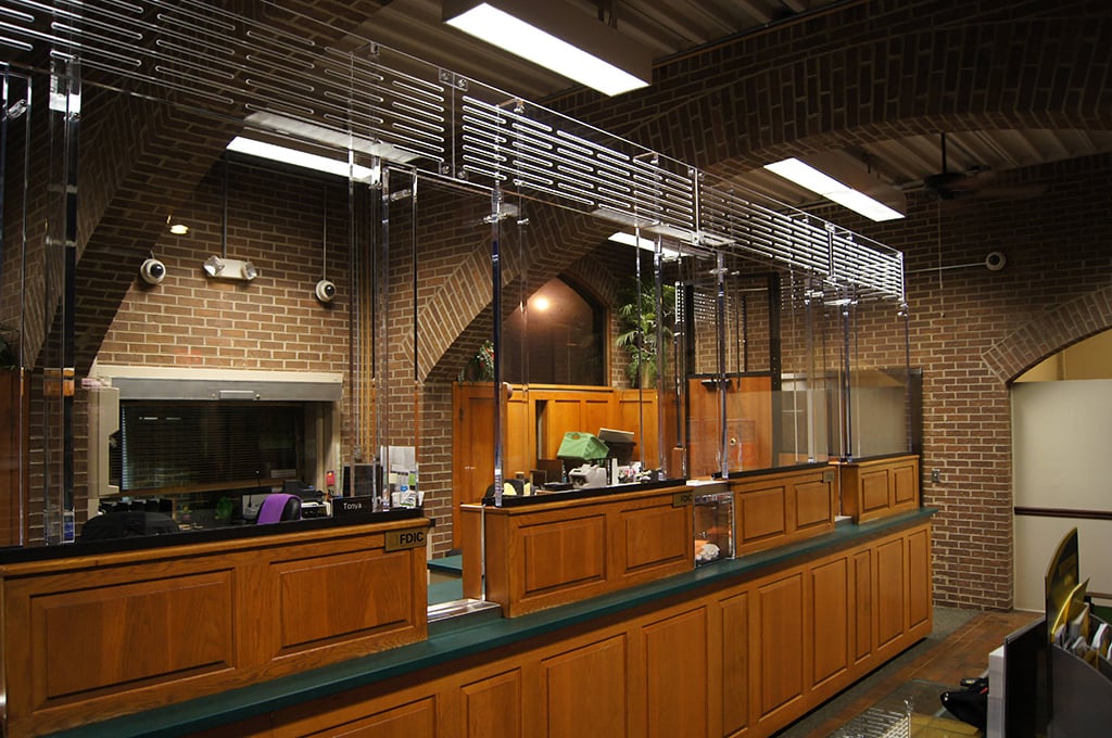 Bank teller line with bullet-resistant glass partition